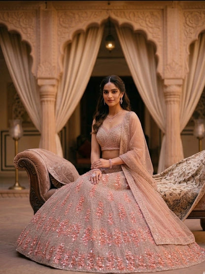 Woman in a traditional embroidered outfit sitting on a decorative chair in an ornate room.